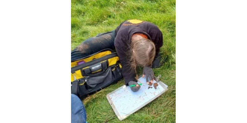 Marcie Weeks in the field, working on some Late Iron Age / Early Romano-British pottery at an Iron Age promontory fort.